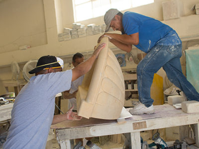 Experienced Limestone Company Working Hard to Sculpt an Ornate Decorative Piece 5-25