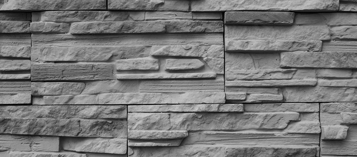 Limestone company creating cool limestone wall to add great character to house