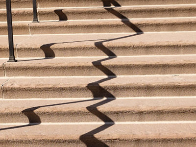 Limestone stairs with railing shadow