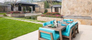 Beautiful backyard patio with limestone steps and walls