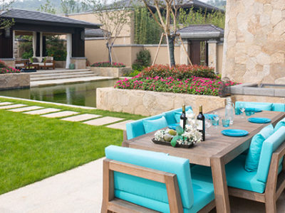 Beautiful backyard patio with limestone steps and walls