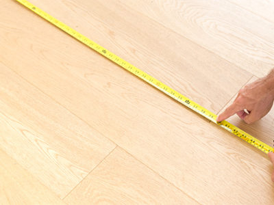 Man-measuring-the-floor